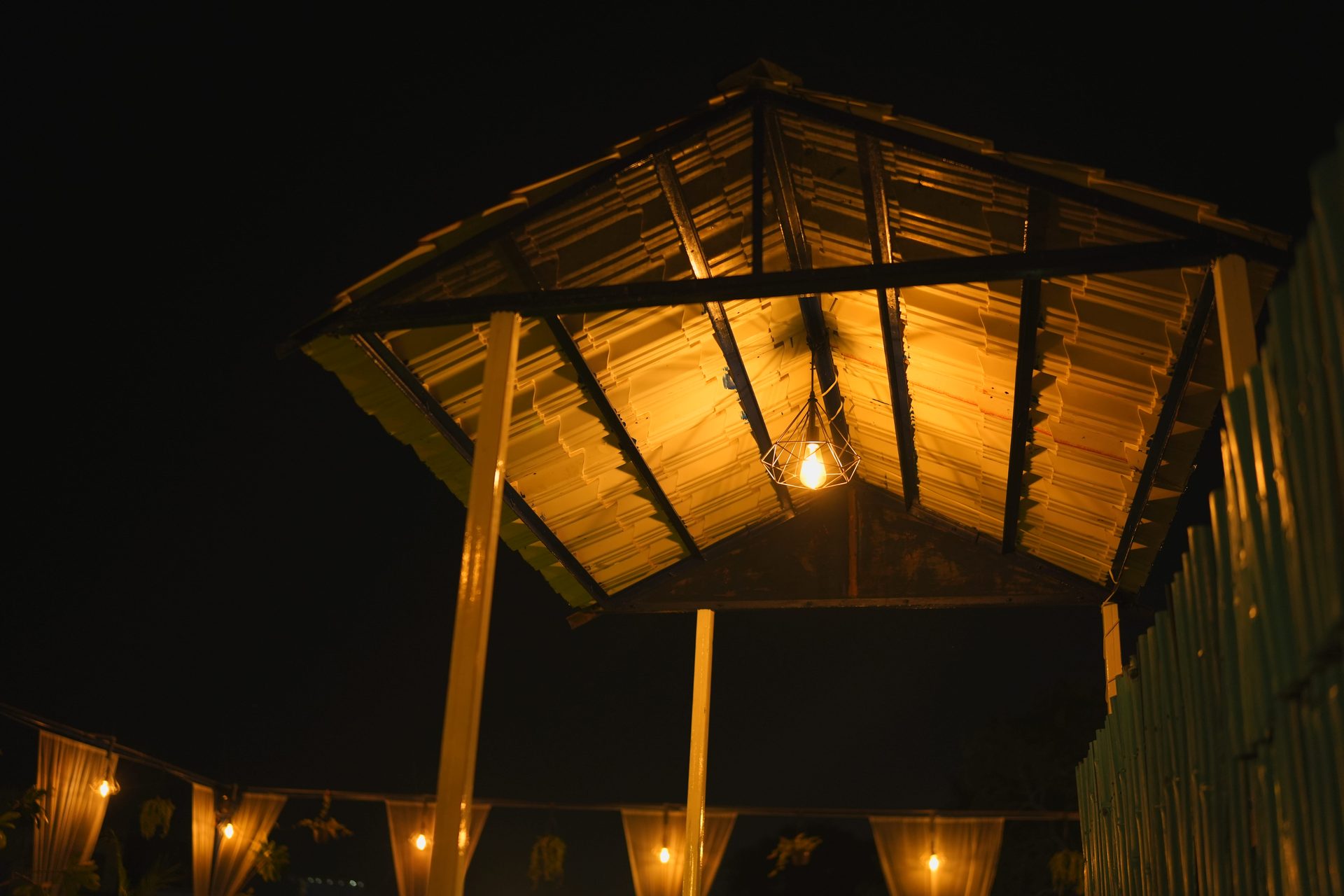 Greek-themed lakeside cafe at sunset